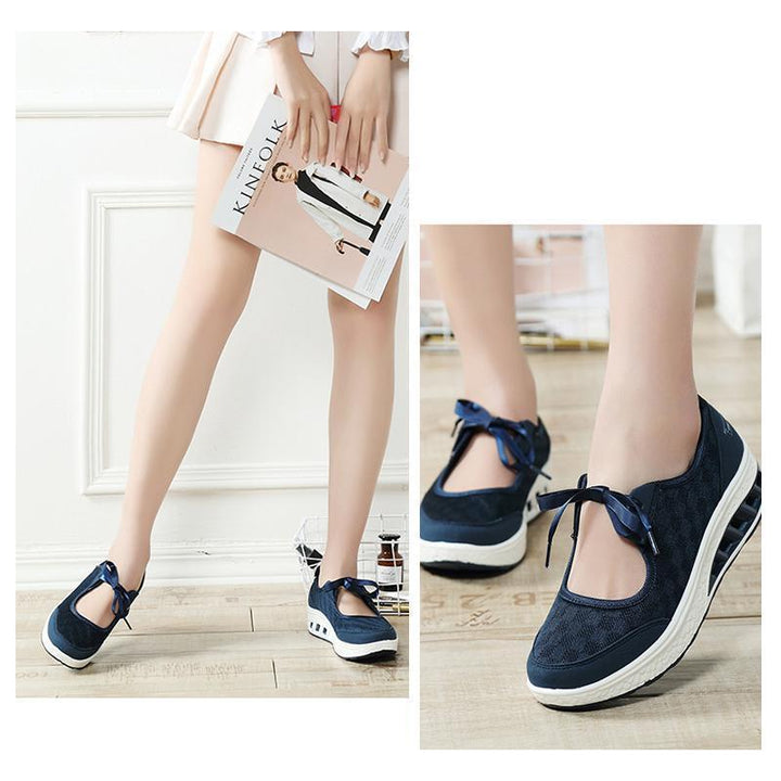 Women's denim blue slip-on platform wedge sneakers featuring a comfortable round toe design