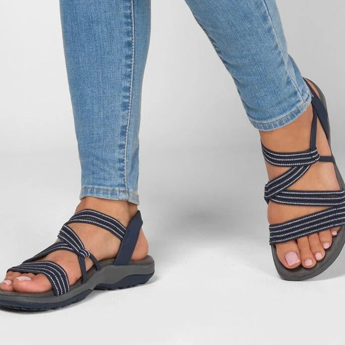 Women's black strappy comfort sandals, perfect for outdoor spring and summer wear, featuring adjustable straps.