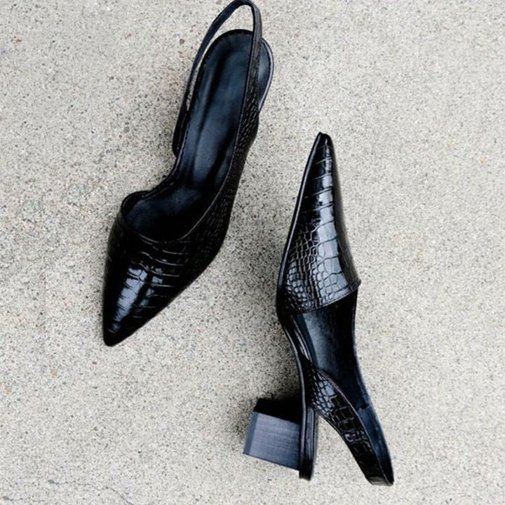 Elegant women's black comfort loafers, offering supportive heels for stylish all-day wear.