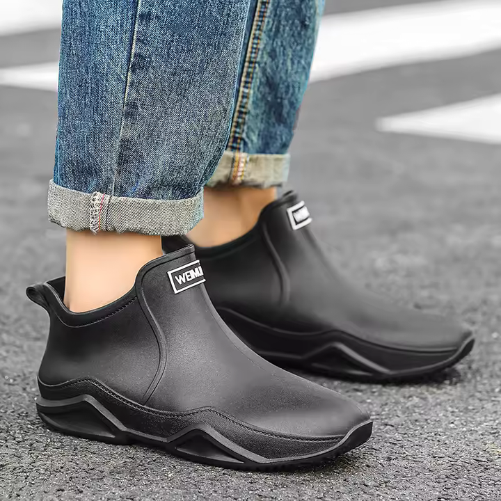 Fashionable women's waterproof ankle boots, easy slip-on design, ideal for rainy days & outdoor utility.
