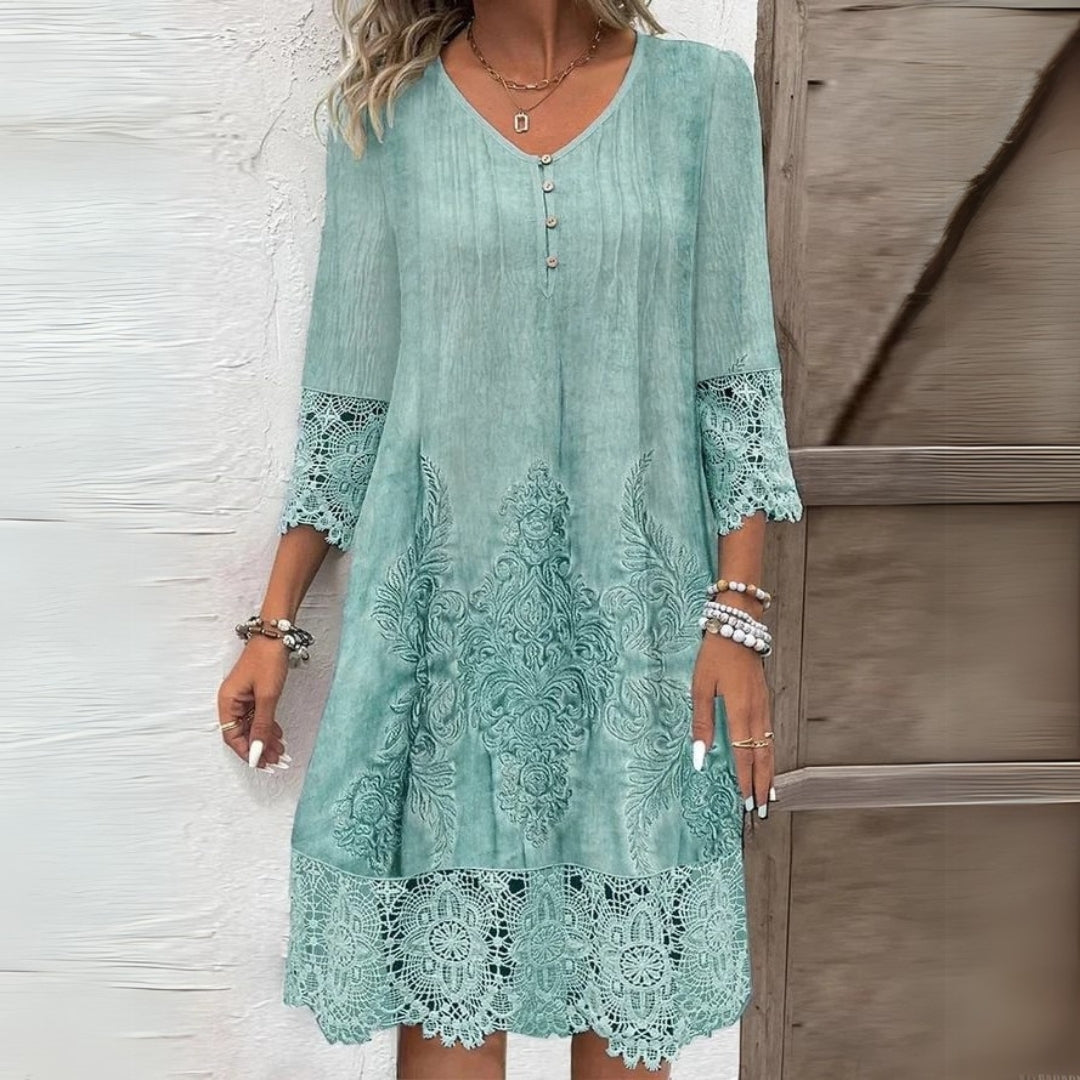 Relaxed fit women's boho midi dress featuring intricate embroidery and feminine lace trim detail.