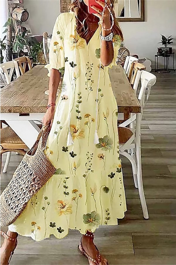 Elegant women's flowy floral maxi dress featuring flounce sleeves & chic tassels, ideal for spring casual.