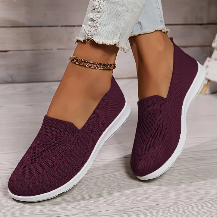 Women's comfort slip-on walking shoes featuring a breathable upper. Perfect lightweight footwear for daily adventures.