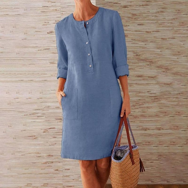 Relaxed fit women's shift dress, knee-length midi with functional button front & pockets, versatile summer style.