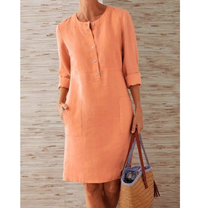 Casual women's button-front midi dress, three-quarter sleeves & side pockets, comfortable everyday shift style.