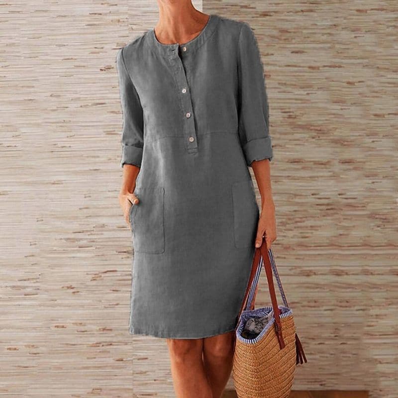 Versatile women's midi shift dress, knee-length, button front, pockets & 3/4 sleeves for casual summer outfits.