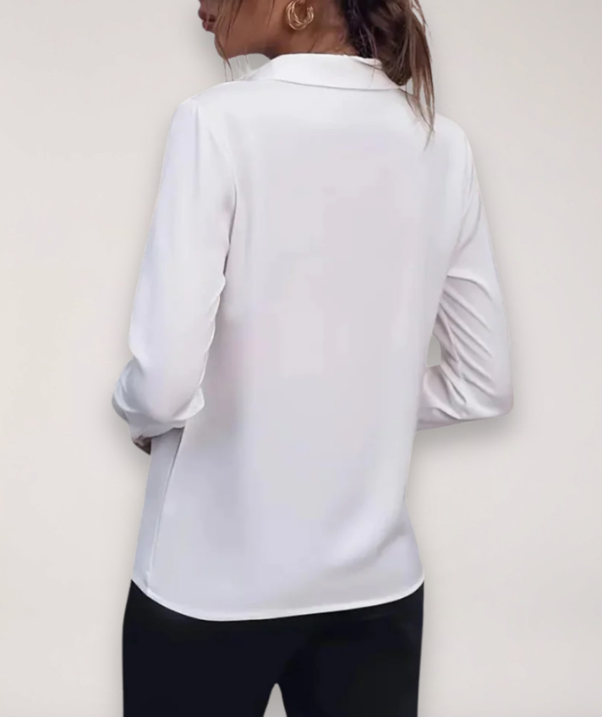 Elegant women's office blouse with intricate buttons, perfect for spring fashion and formal wear.
