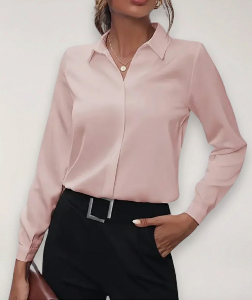Women's professional work blouse, a classic buttoned top suitable for diverse office environments.