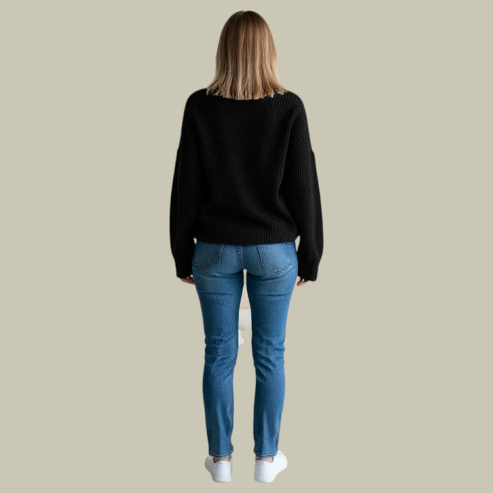 Close-up of the knit texture on a women's casual relaxed fit high neck winter sweater