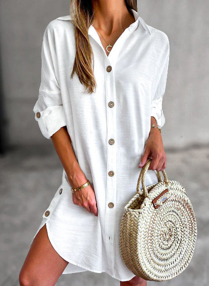 Lightweight women's button-down shirt dress with roll-tab sleeves, ideal for casual summer fashion.