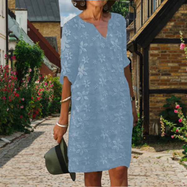 Fashionable women's casual midi dress featuring an elegant floral print and comfortable fit.