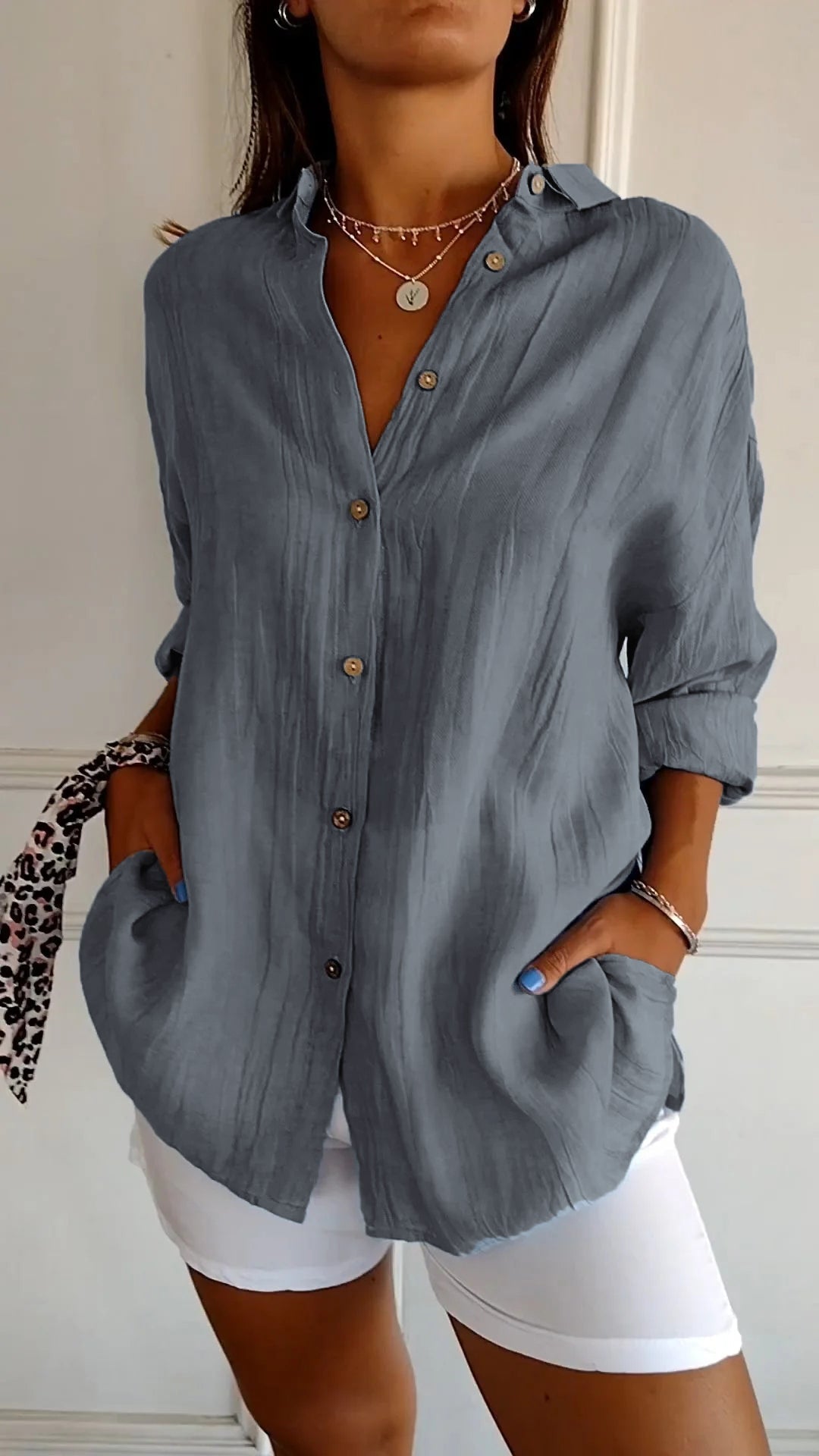 Long sleeve women's shirt in a casual button-down design, offering effortless summer style.