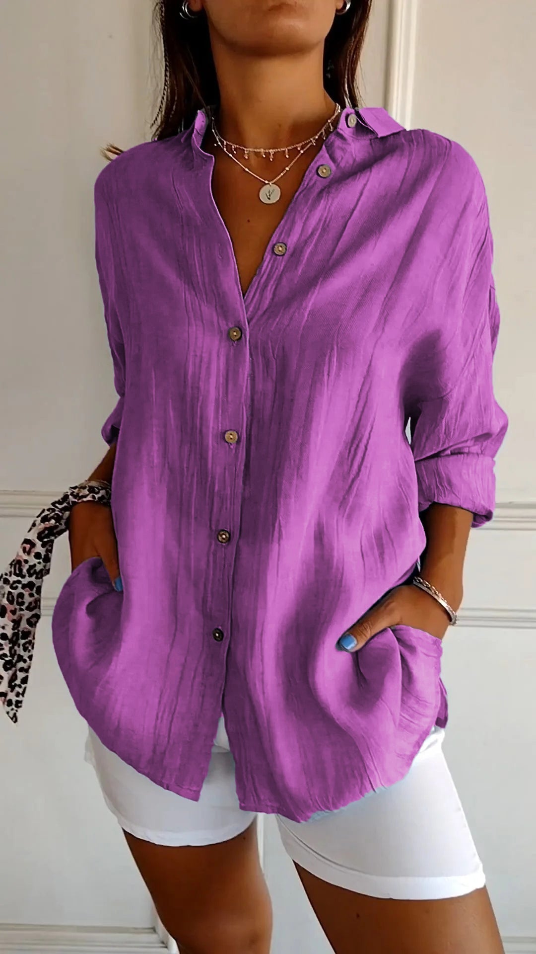 Relaxed fit women's casual button-down top, perfect for layering or as a chic beach cover-up.