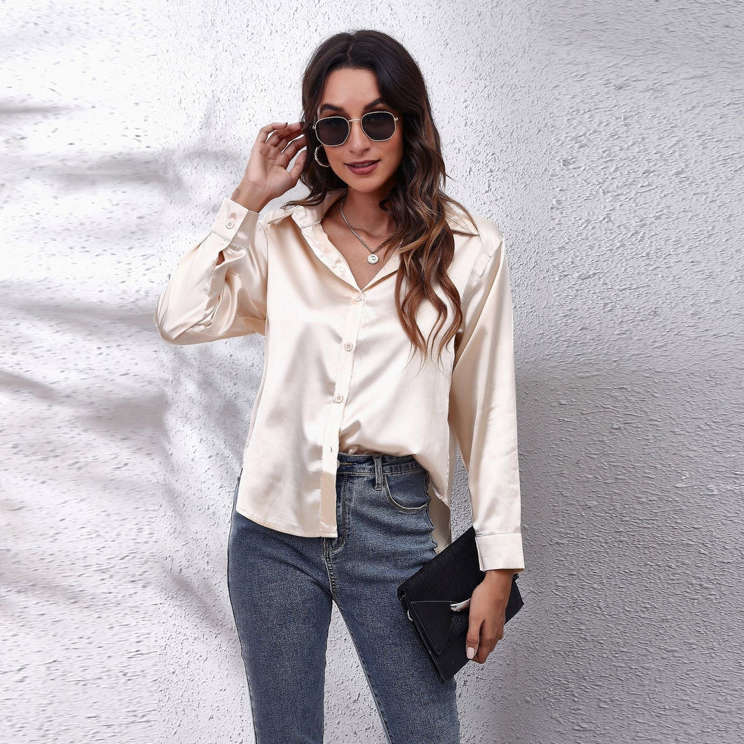 Back view of a women's loose fit satin blouse, showing the comfortable and fashionable silhouette