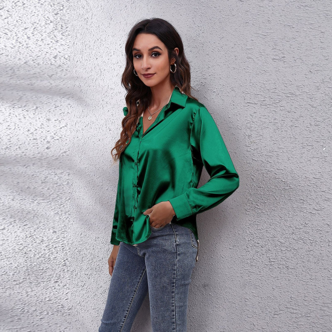 Light pink women's elegant satin blouse with a loose fit, perfect for a refined casual or work look