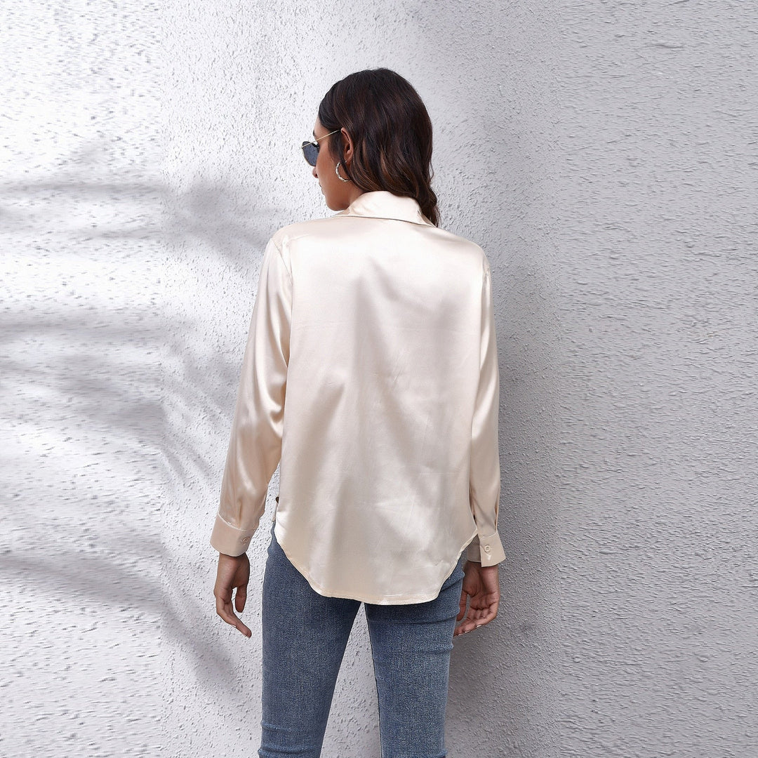Stylish women's satin top with a relaxed fit, suitable for both casual wear and professional work environments