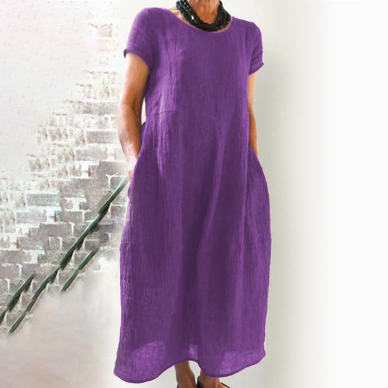 Simple yet chic women's T-shirt dress, solid color, loose fit, great for relaxed occasions.