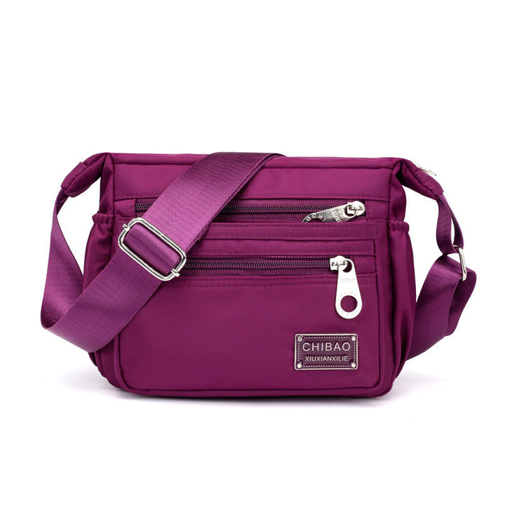 A close-up of the durable nylon fabric texture on the women's casual shoulder bag, quality material