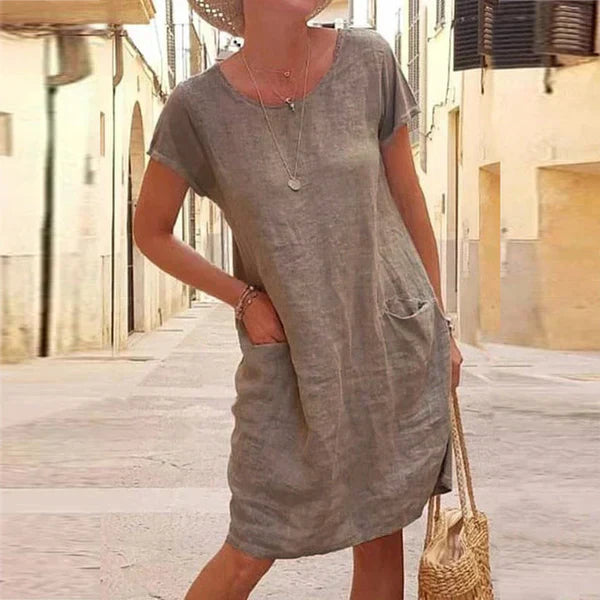 Stylish women's short sleeve casual midi dress with functional pockets. A comfortable and versatile everyday summer gown.