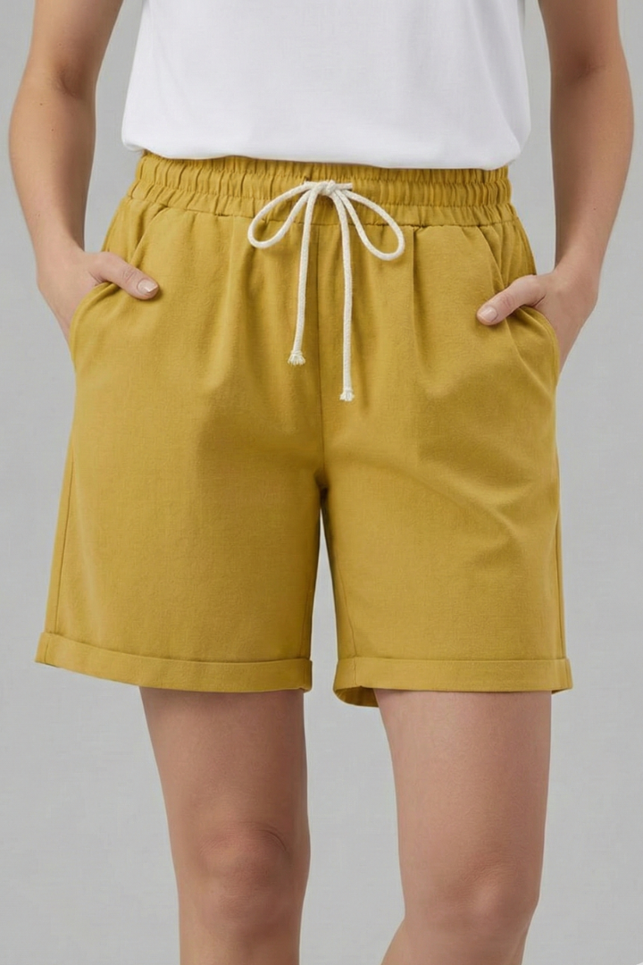 Chic women's casual shorts with elastic waist, drawstring, cuffed hem, & relaxed fit for summer comfort.