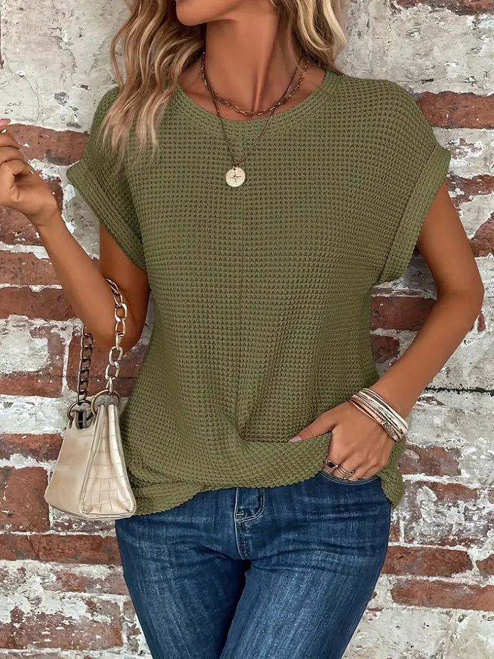 Soft textured women's blouse with a chic twist front. Perfect for comfortable, everyday modern fashion.