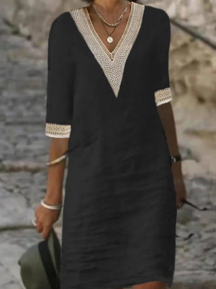 Elegant women's V-neck dress with lace trim and 3/4 sleeves. Versatile relaxed fit for casual or stylish spring outings.