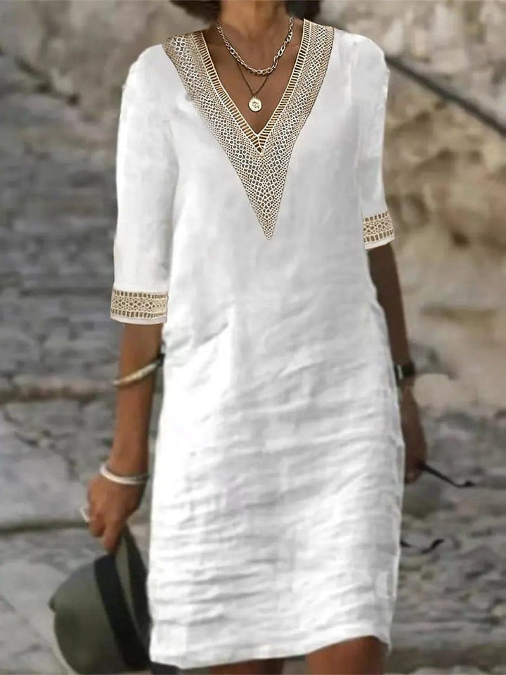 Full view of women's comfortable V-neck lace trim dress with 3/4 sleeves, relaxed fit, ideal for casual spring fashion.