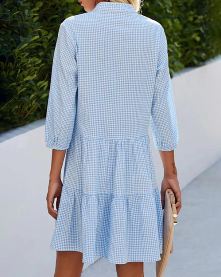 Everyday women's blue checkered short sleeve summer dress, midi length, lightweight and chic for casual wear.
