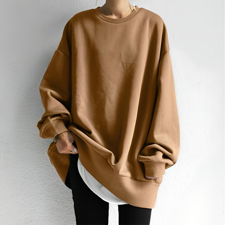 Women's chic oversized knit sweater. Cozy long-sleeve pullover, perfect for stylish fall and winter casual wear.