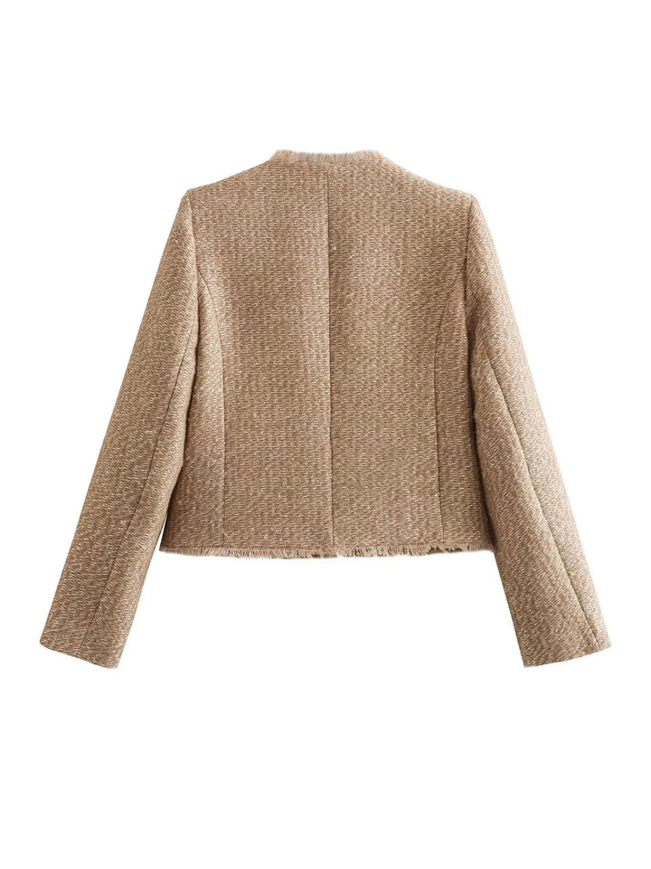 Chic women's cropped blazer in tweed fabric, adorned with fashionable buttons, front view.