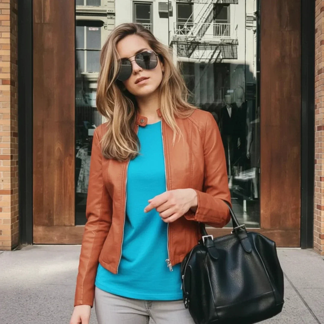 Fashionable women's zip-up fitted jacket. Modern style chic outerwear, collarless design. Versatile for any look.