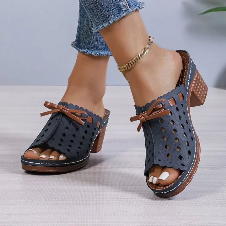 Elegant women's cutout block heel mules, offering a blend of style and all-day comfort.