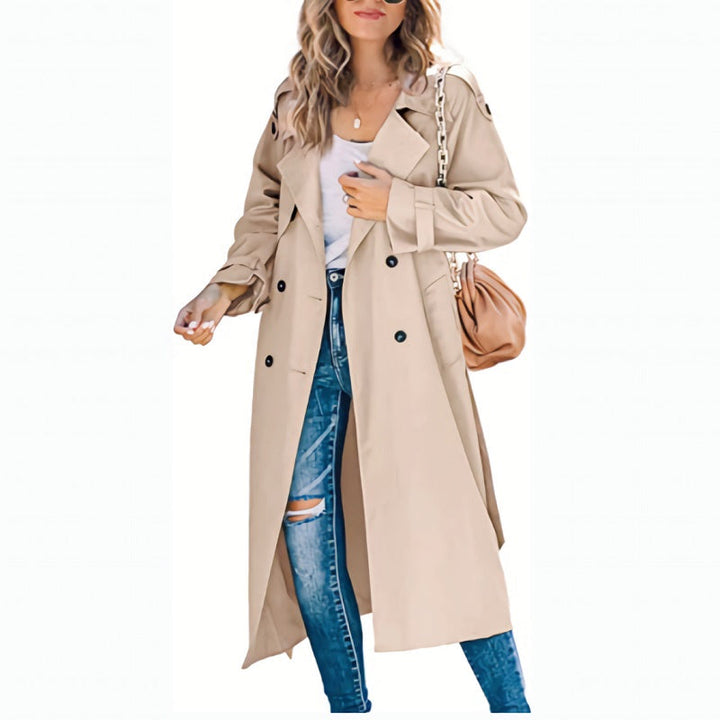 Double-breasted women's long trench coat with belt, an elegant transitional spring/fall jacket.