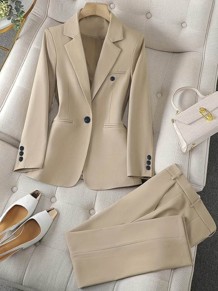 Professional women's blazer and matching pant set, perfect for business meetings & formal office fashion.