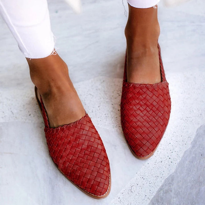 Sleek women's closed toe flat mules, a stylish slip-on design providing modern comfort & elegance.