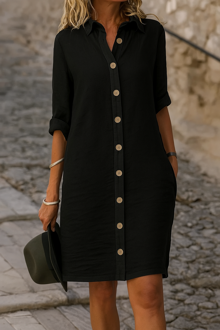 Versatile women's day dress, button-front, with roll-tab sleeves for warmer days.