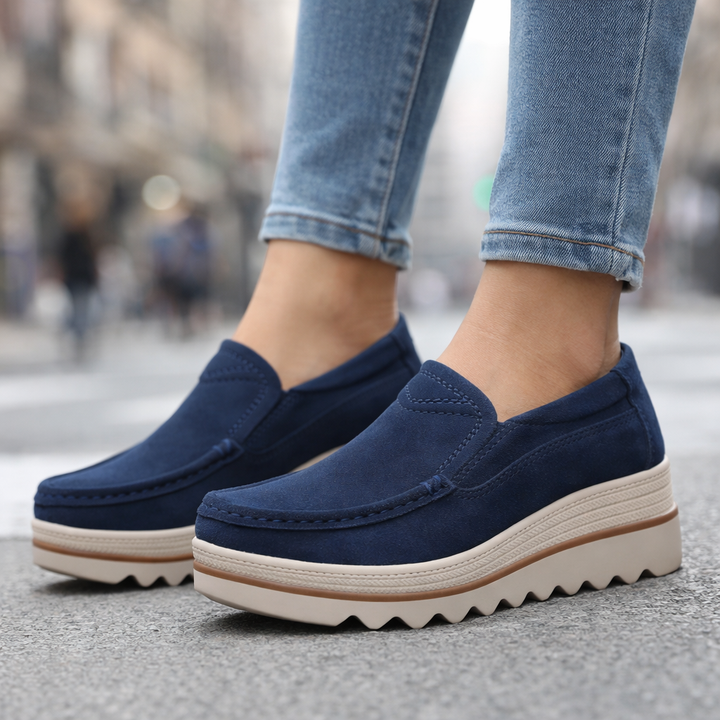 Stylish women's black platform loafers in suede, perfect for casual wear, with orthopedic support