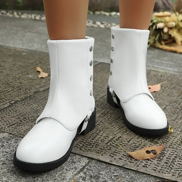 Side view of a comfortable women's vegan leather ankle boot with a practical and stylish block heel.