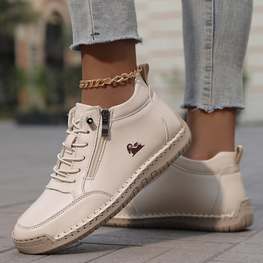 A stack of women's comfortable zip-up walking sneakers in different colors, showing variety.