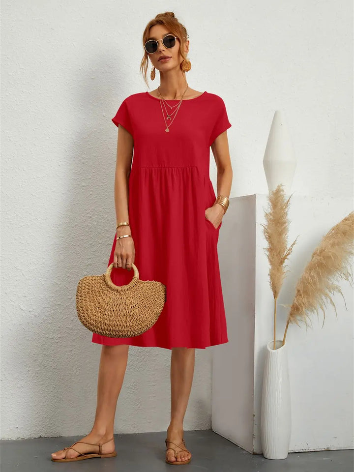 Women's comfortable casual midi dress with practical pockets, ideal for everyday wear.