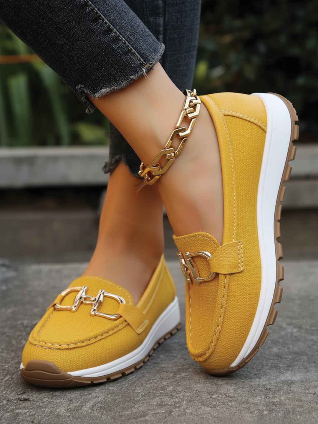 Yellow women's comfortable flat loafers with elegant buckle. Easy slip-on everyday casual shoes.
