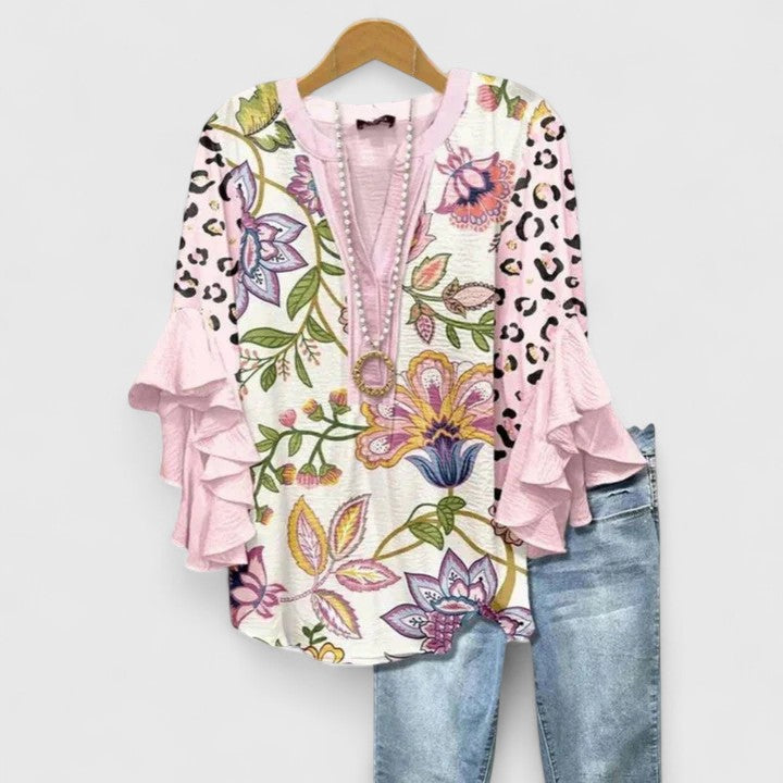 Lightweight women's summer blouse, vibrant floral print & delicate ruffle sleeves.