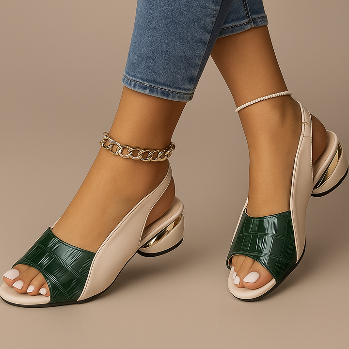 Close-up of women's comfortable slingback sandals with a stylish low block heel and croc texture