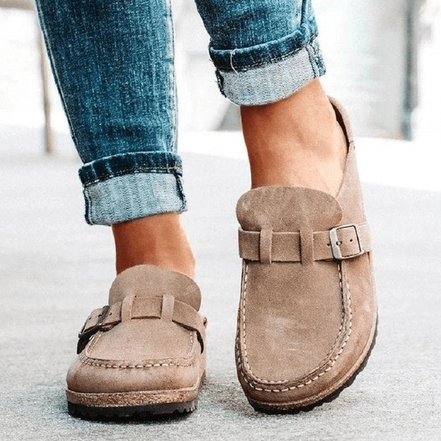 Side view of women's orthopedic mules, showcasing comfortable design & slip-on convenience for support.