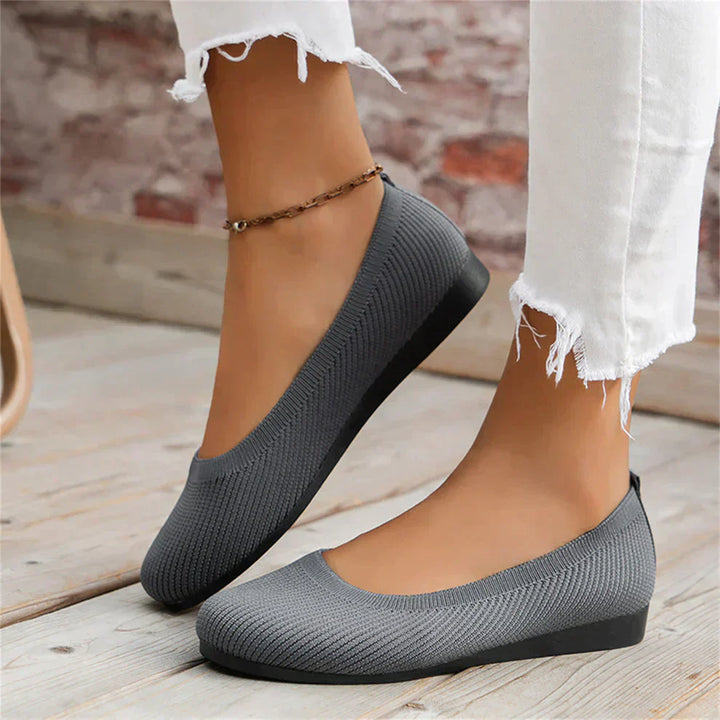 Close-up of a women's versatile beige ballet flat, showcasing soft material.