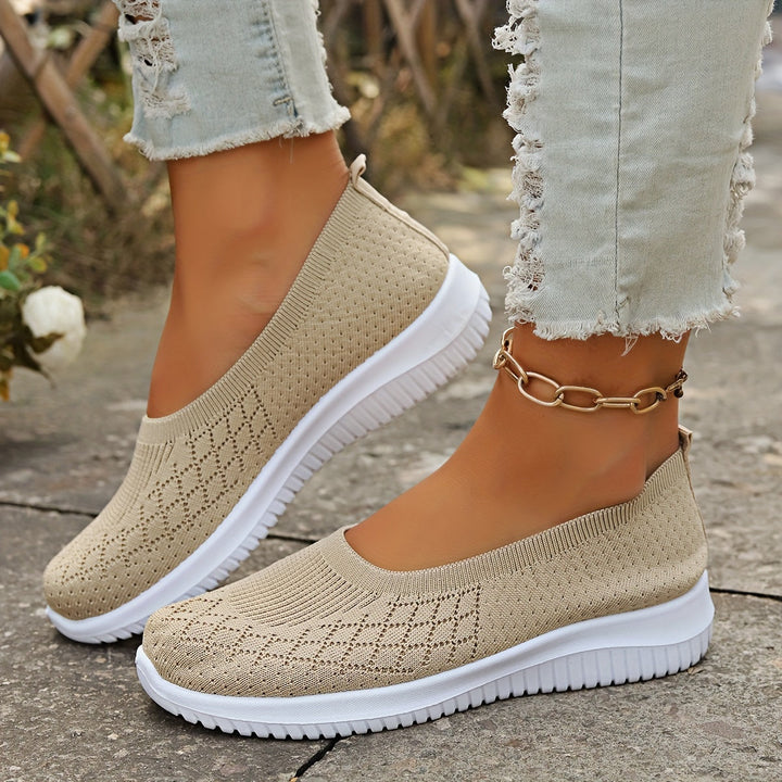 Stylish women's slip-on shoes, perfect for casual everyday wear. Comfortable and modern walking footwear.