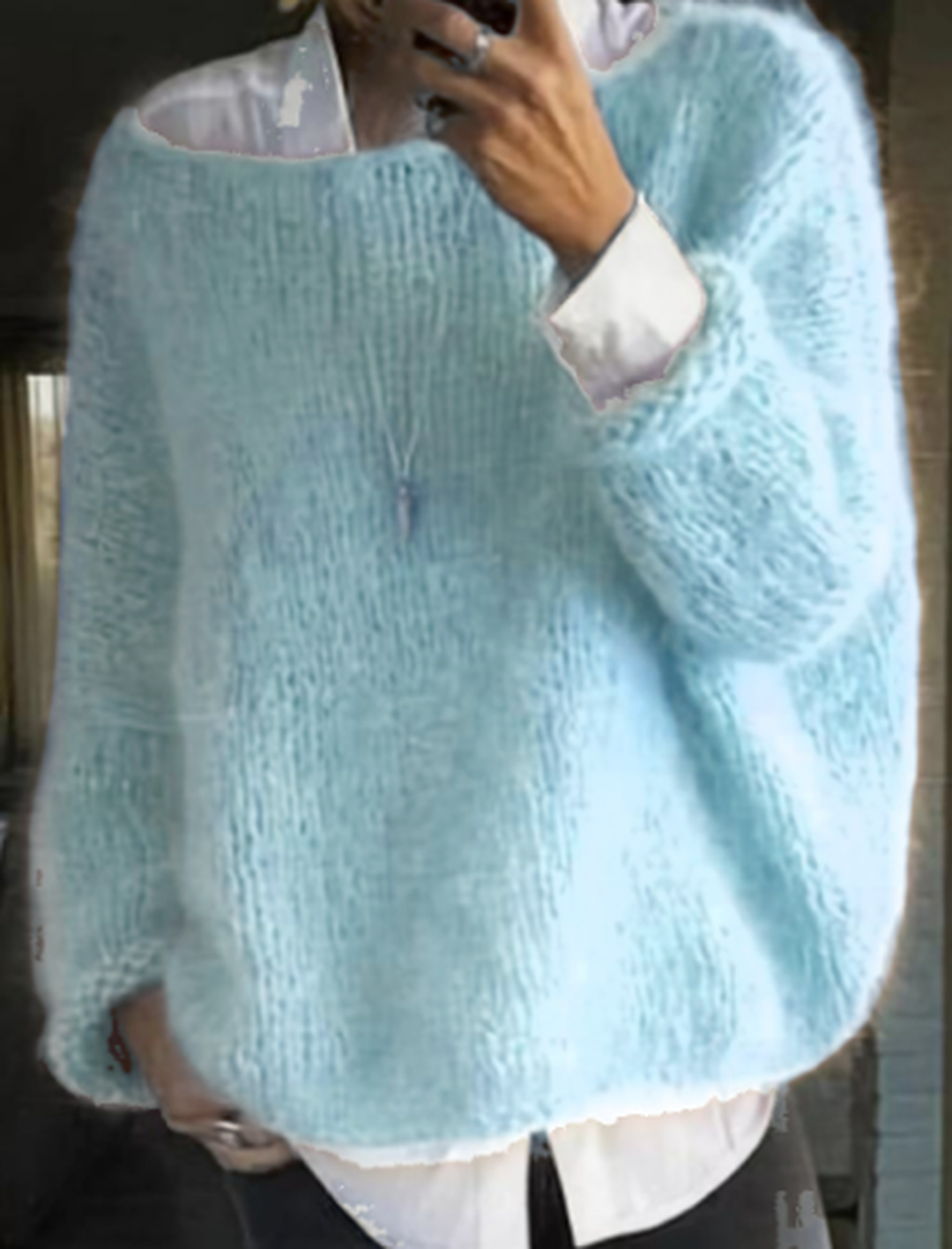 Detail of the ribbed cuffs on a women's cozy long sleeve knit sweater, adding to its classic look.