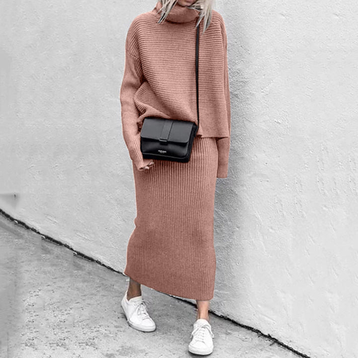 Women's cozy knit pullover and ribbed skirt set in a soft, neutral tone, ideal for casual chic comfort.