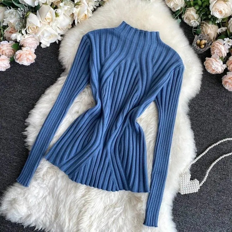 Elegant women's solid color roll neck sweater, long sleeve for office or casual autumn/winter chic.
