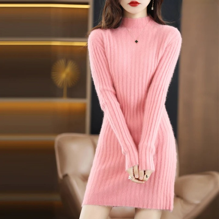 Knitted women's sweater dress with a cozy roll neck. Versatile, long sleeve, above knee for autumn.